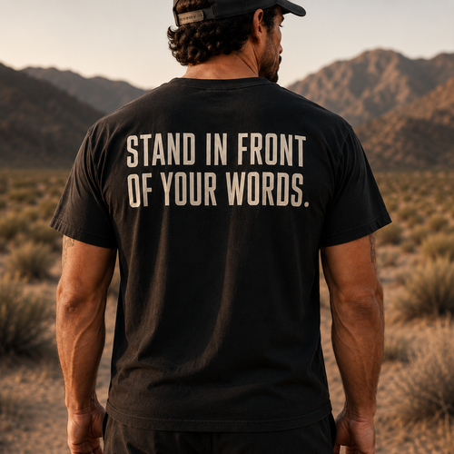 Back view of Muscular America black T-shirt featuring the phrase "STAND IN FRONT OF YOUR WORDS."